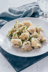 Dumplings with greens in a plate