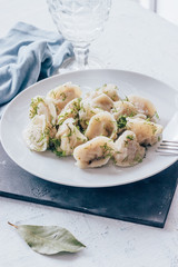 Dumplings with greens in a plate
