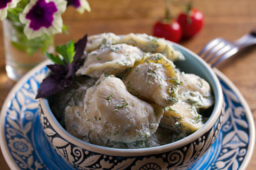 Dumplings stuffed with popato. Pierogi, varenyky, vareniki, pyrohy - dumplings with filling. Healthy vegetarian homemade food