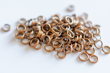 Jewelry findings connecting double rings, handmade craft concept.