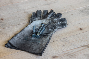 dirty workgloves with screws