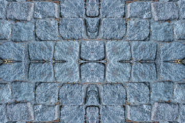 Texture of cobblestone pavement and gray stone.