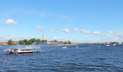 Walking along the Neva near the Peter and Paul Fortress. St. Petersburg.