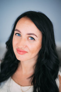 Portrait of brunette girl without retouching, visible skin problems