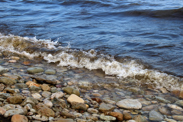 Large waves of sea and stones beach
