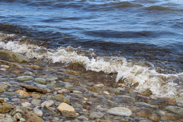 Large waves of sea and stones beach