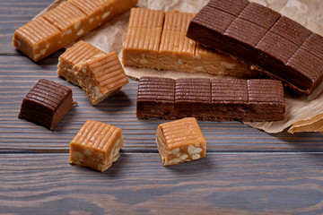 .Traditional oriental sweets - sherbet with chocolate and nuts on a wooden table. Selective focus