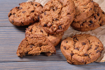 Chocolate oatmeal chip cookies on the rustic wooden table.