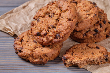 Chocolate oatmeal chip cookies on the rustic wooden table.