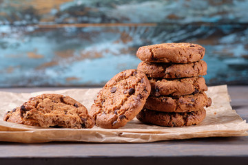 Chocolate oatmeal chip cookies on the rustic wooden table.