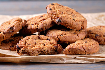 Chocolate oatmeal chip cookies on the rustic wooden table. close-up