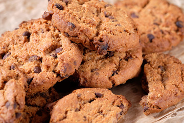 Chocolate oatmeal chip cookies on the rustic wooden table. close-up