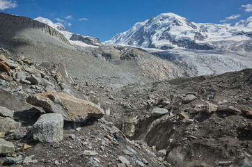 Fototapeta na wymiar Destruction of glaciers in the Swiss alps. Switzerland. Summer.