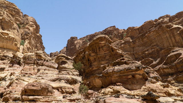 View of rocky hills and mountains in prehistoric rock carved city Petra, UNESCO World Heritage, the capital of the kingdom of the Nabateans in ancient times, Jordan.