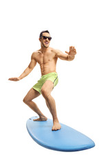 Attractive young surfer on a surfboard - obrazy, fototapety, plakaty
