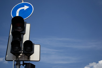 Traffic lights against a blue sky
