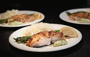 delicious meal prepared salmon in crust, black background