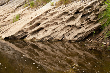 Stone mountain is reflected in the river