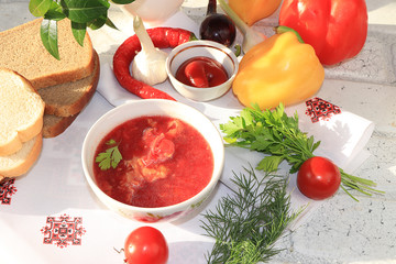 Traditional Russian borsch with egg and bread on a wooden table ,. Delicious traditional natural food and cooking ingredients, healthy diet concept, top view,