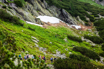 Group of hikers on a path to High Tatras mountains
