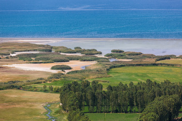 Beautiful landscape with a lake Van, Eastern Anatolia, with turquoise water and reed beds on the shore