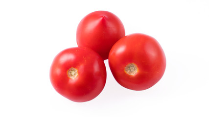 three tomatoes on a white background
