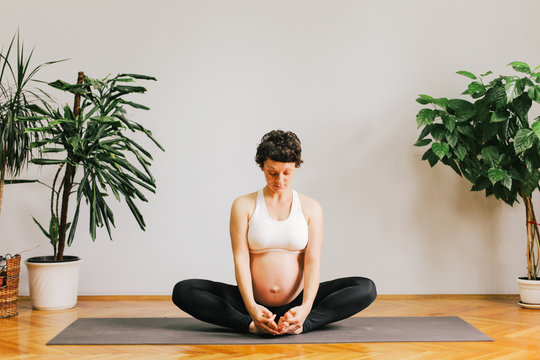 Pregnant woman practicing yoga