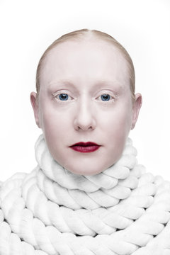Portrait of woman with rope coiled around her neck