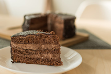 Chocolate cut cake top view. Sweet chocolate pie.