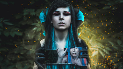 Demon feminine with black eyes holding a mirror. From the mirror she eats out girl, girl screaming...