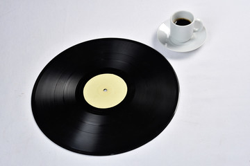 Obraz premium old vinyl record with coffee