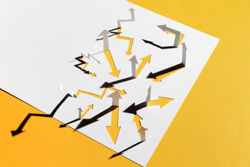Confusing paper arrows on yellow