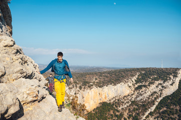 Couple of climbers walking a path at summit of a multipitches route