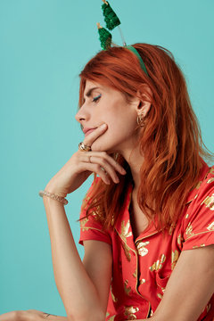 Beautiful transgender model doubtful in christmas clothing