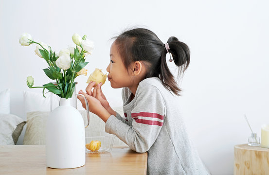 Little girl eating fruit durian