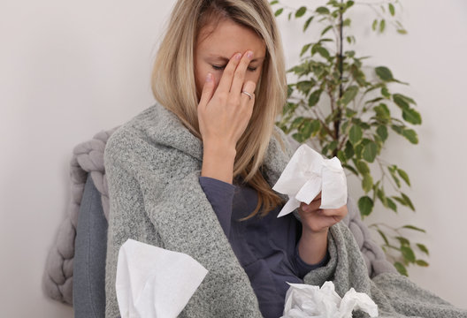 Woman Sneezing into Tissue. Flu, Allergy, Runny Nose