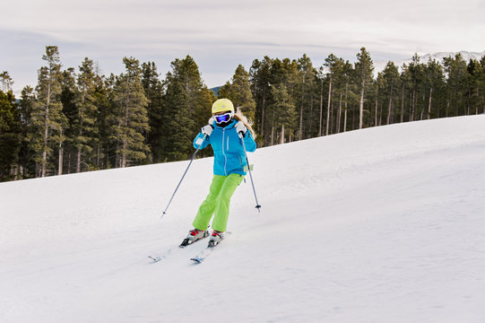 Pre-teenage girl skiing in winter
