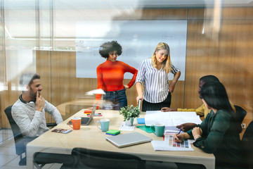 Diverse people working in stylish office