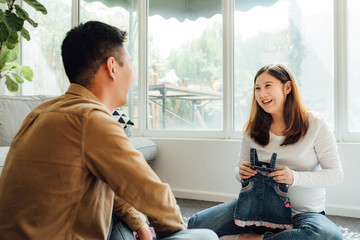 Young couple feeling happy about their coming child
