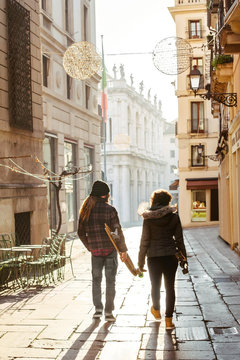 Adult couple longboarding together