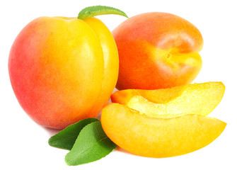 apricot fruits with slices and green leaf isolated on white background