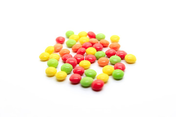 Bright multicolored candy on a white background
