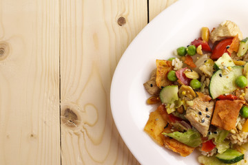 Tasty healthy dinner with chicken meat, fresh vegetables and rice, close up
