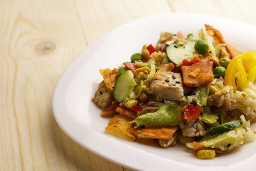 Tasty healthy dinner with chicken meat, fresh vegetables and rice, close up