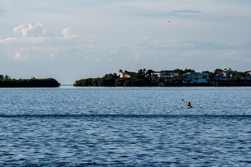 Landscape of Islands in Florida with a lone person in a kayak getting his daily exercise