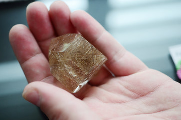 Rutilated Smokey Quartz tower being held in woman's hand. Wiccan healing crystal alter, witchy...