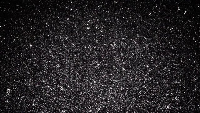  Black Sparkling Obsidian Glitter. Seamlessly looping animated background.