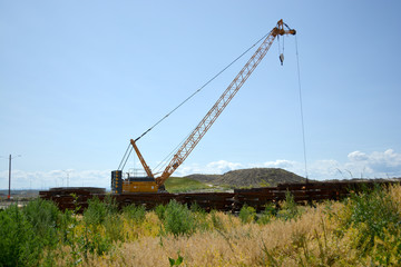 Crane equipment working on highway construction site