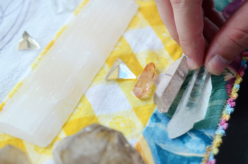 Beautiful Clear Quartz being held in woman's hand. Bright Quartz crystal, healing crystal being...