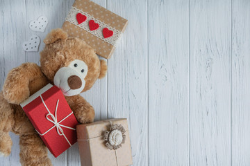Design of the congratulatory banner with boxes and a toy bear on a white background. Frame for birthday greeting card. Sale and gifts, store promotions